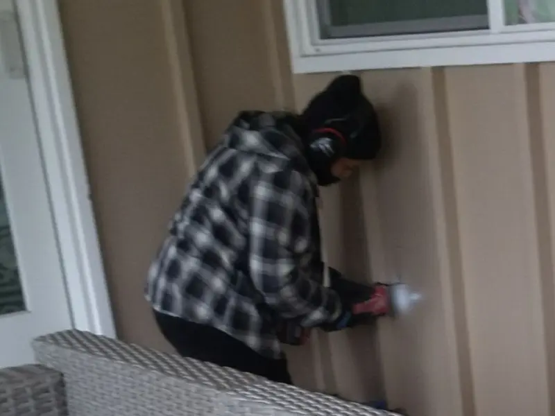 Professional electrician installing an exterior outlet in Ferry Pass