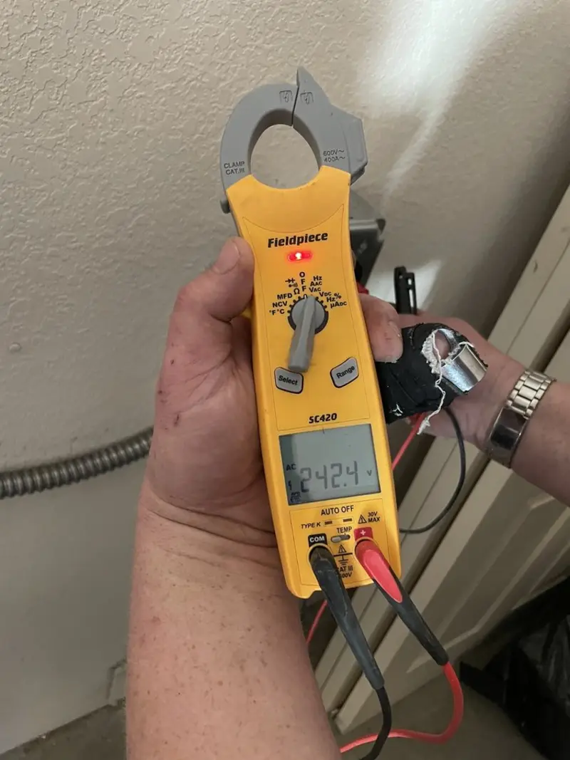 Voltage testing with clamp meter during Outlet Installation in Ferry Pass